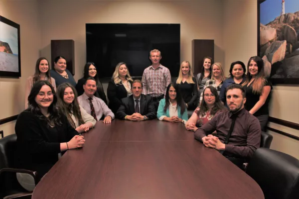 Acadia Law Group staff in conference room. A Utah personal injury attorney